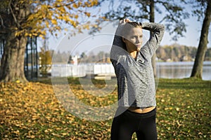 Caucasian blonde Scandinavian fitness girl training outdoors in Sweden