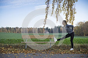 Caucasian blonde Scandinavian fitness girl training outdoors in Sweden