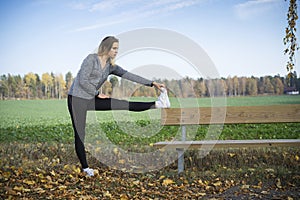 Caucasian blonde Scandinavian fitness girl training outdoors in Sweden