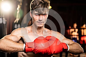 Caucasian boxer put his hand or fist wearing glove together. Impetus