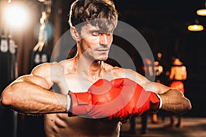 Caucasian boxer put his hand or fist wearing glove together. Impetus