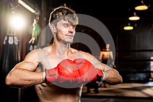 Caucasian boxer put his hand or fist wearing glove together. Impetus