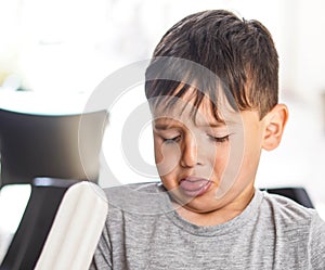 Caucasian boy enjoying a coconut lolly