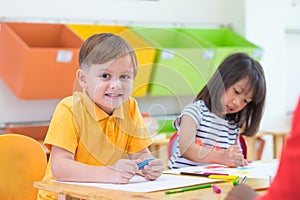 Caucasian boy ethnicity kid smiling white learning in classroom