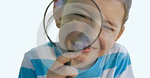 Caucasian boy with magnifying glass gainst copy space on white background photo