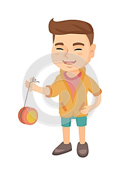 Caucasian boy playing with yo-yo.