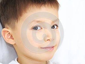 Caucasian boy portrait smiling, peripheral vision