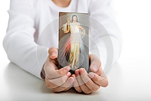 Caucasian boy showing Merciful Jesus icon photo