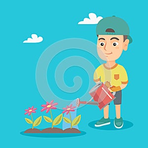 Caucasian boy watering flowers in the garden.