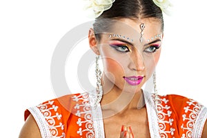 Caucasian brunette woman in orange indian national dress sari