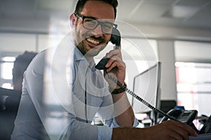 Caucasian business man having conversation on Landline phone. Bu