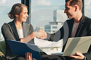 Caucasian business people having handshake after business deal success