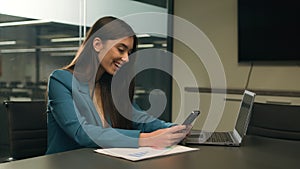 Caucasian business woman office worker reading good news in phone mobile notification amazed funny sms wonder amazement