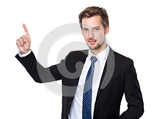 Caucasian businessman with finger touch imagery panel