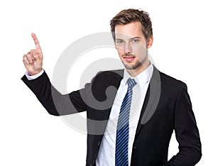 Caucasian businessman with finger touch imagery panel photo