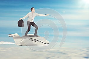 Caucasian businessman flying with mouse