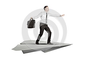 Caucasian businessman with paper plane isolated over white