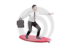 Caucasian businessman surfing over white background