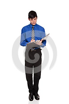 Caucasian businessman writing on blank notepad