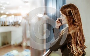 A caucasian businesswoman phoning