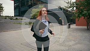 Caucasian businesswoman run in city business woman girl lady female manager entrepreneur employer manager holding laptop