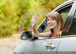 Caucasian car driver woman smiling