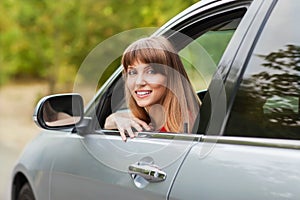 Caucasian car driver woman smiling