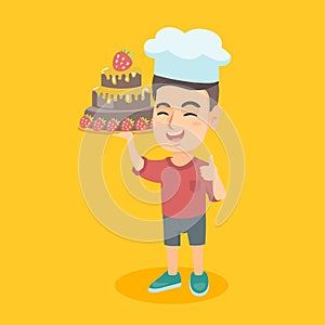 Caucasian child in chef hat holding a cake.