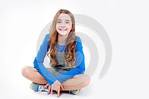 Caucasian child girl portrait.Smiling teenager,schoolgirl on white background