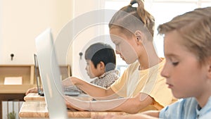 Caucasian child programing software system and learning about coding. Pedagogy.