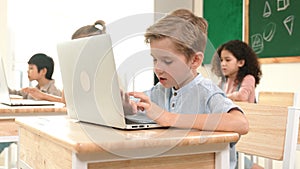 Caucasian child programing software system and learning about coding. Pedagogy.