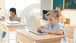 Caucasian child programing software system and learning about coding. Pedagogy.