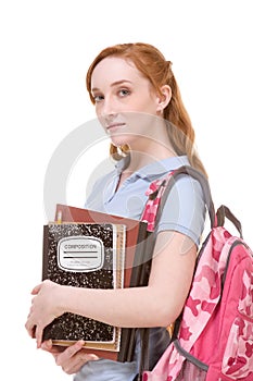 Caucasian college student with backpack copybooks