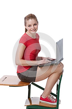 Caucasian college student on desk with laptop PC