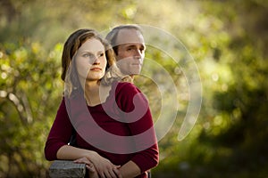 Caucasian couple in love on outdoor wooden bridge