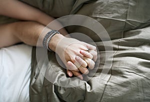 Caucasian couple lying on bed together