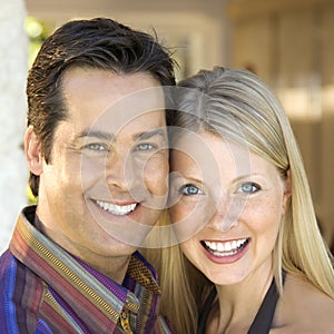 Caucasian couple smiling.