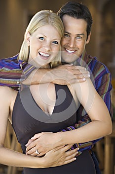 Caucasian couple smiling.