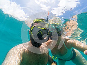 Caucasian couple snorkling