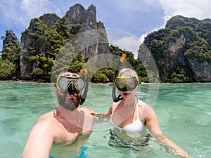 Caucasian couple snorkling