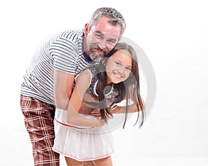 Caucasian dad hugging asian daughter