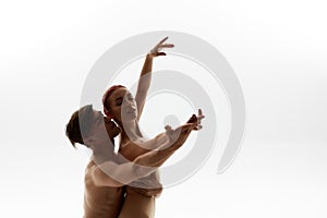 Caucasian dance couple dancing ballet in studio