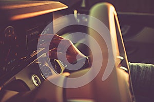 Caucasian Driver Setting Up Modern Car Infotainment Close Up Photo