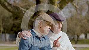 Caucasian elderly couple spending time in park