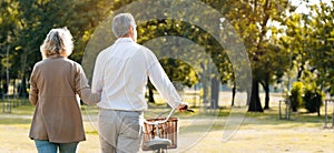 Caucasian elderly couples come to happy in park during the summer. Of long holidays and Picnic. Tourism activities Of retire. Frie