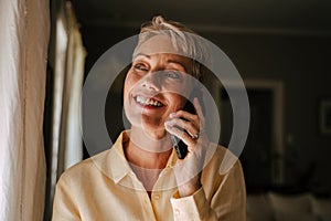 Caucasian elderly women talking on cellular device