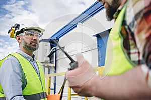 Caucasian engineer meeting with colleague and shake hand