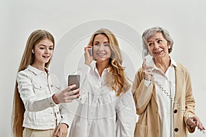 Caucasian family of females use variety phones