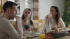 Caucasian family having a vivid conversation during the breakfast.