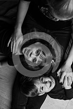 Caucasian Family Portrait in Black and White. mom daughter and son. caucasian family with two children